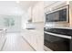 Modern kitchen with stainless steel appliances, ample cabinet space, and bright natural light at 7067 Sw 60Th Ln, Ocala, FL 34474