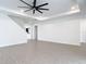 Open-concept living area with tile floors, recessed lighting, and a glimpse of the staircase at 7067 Sw 60Th Ln, Ocala, FL 34474