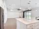 Open-concept living area with tile floors, modern lighting, and seamless indoor-outdoor flow at 7067 Sw 60Th Ln, Ocala, FL 34474
