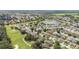 This beautiful aerial view shows this community's golf course, ponds and mature trees at 7243 Se 172Nd Legacy Ln, The Villages, FL 32162