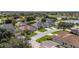 Enjoy this aerial view of the neighborhood homes and golf course in the distance at 7243 Se 172Nd Legacy Ln, The Villages, FL 32162