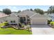 Charming one-story home with landscaped front yard and neutral stucco at 7243 Se 172Nd Legacy Ln, The Villages, FL 32162