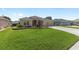 Well-manicured lawn and neutral stucco highlight the exterior of this lovely home at 7243 Se 172Nd Legacy Ln, The Villages, FL 32162