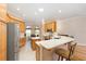 Bright kitchen features stainless steel appliances, a breakfast bar, and an adjacent breakfast nook for casual dining at 7243 Se 172Nd Legacy Ln, The Villages, FL 32162