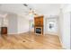 Spacious living room with fireplace, hardwood floors, and ceiling fan at 7243 Se 172Nd Legacy Ln, The Villages, FL 32162