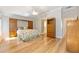 Spacious main bedroom with wood floors, built-in wardrobes, and en suite access at 7243 Se 172Nd Legacy Ln, The Villages, FL 32162