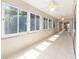Extended sunroom featuring many windows for natural light and views of the outdoors at 7243 Se 172Nd Legacy Ln, The Villages, FL 32162