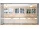 Bright sunroom with tile flooring, ceiling fans, and large sliding glass doors at 7243 Se 172Nd Legacy Ln, The Villages, FL 32162