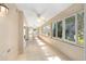 Inviting sunroom filled with natural light from the many large windows at 7243 Se 172Nd Legacy Ln, The Villages, FL 32162