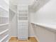 Well organized walk-in closet with shelves, drawers, and hanging rods at 7243 Se 172Nd Legacy Ln, The Villages, FL 32162