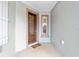 Close-up of the home's front door with decorative glass and neutral colored trim at 7454 Sw 101St Ave, Ocala, FL 34481