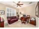 Bright home office with large windows, comfortable seating, and a functional workspace at 7454 Sw 101St Ave, Ocala, FL 34481