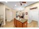 Charming kitchen area boasts an island, and a breakfast nook area with large windows and stylish decor at 7454 Sw 101St Ave, Ocala, FL 34481