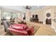 Bright and airy living room featuring wood floors, comfortable seating, and a ceiling fan at 7454 Sw 101St Ave, Ocala, FL 34481
