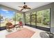 A screened patio features ample seating and views of the backyard, perfect for outdoor relaxation at 7454 Sw 101St Ave, Ocala, FL 34481