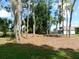 Lush backyard featuring mature trees, a level lawn, and a serene, natural setting at 80 Hickory Course Loop, Ocala, FL 34472