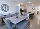 Inviting dining area featuring a marble table, chairs, and open access to the modern kitchen at 80 Hickory Course Loop, Ocala, FL 34472
