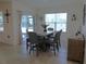 Charming dining area filled with natural light, complemented by a stylish table and chairs at 80 Hickory Course Loop, Ocala, FL 34472
