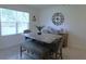 Cozy dining area features a stylish marble table, comfortable seating, and natural lighting at 80 Hickory Course Loop, Ocala, FL 34472