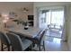 The open concept connects the dining to an outdoor living space at 80 Hickory Course Loop, Ocala, FL 34472