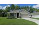Charming single-story home with a two-car garage, manicured lawn, and lovely curb appeal in a Gathering-friendly neighborhood at 80 Hickory Course Loop, Ocala, FL 34472