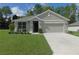 Charming one-story home with a well-manicured lawn and inviting curb appeal at 80 Hickory Course Loop, Ocala, FL 34472