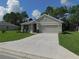 Charming one-story home with a well-manicured lawn and inviting curb appeal at 80 Hickory Course Loop, Ocala, FL 34472