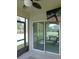 The screened porch provides seamless indoor/outdoor living with a view and access to the backyard at 80 Hickory Course Loop, Ocala, FL 34472