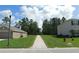 Neighborhood street view highlighting the manicured lawns and tree-lined properties at 80 Hickory Course Loop, Ocala, FL 34472