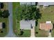 Overhead view of a residential property featuring a well-manicured lawn and tree-lined street at 8461 Sw 109Th St, Ocala, FL 34481