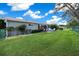 Large, grassy backyard with patio, perfect for outdoor entertaining and relaxation at 8461 Sw 109Th St, Ocala, FL 34481