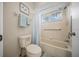 Cozy bathroom with tiled tub/shower combination and floral-themed toilet at 8461 Sw 109Th St, Ocala, FL 34481