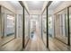 Hallway of mirrored closets leading to a bathroom at 8461 Sw 109Th St, Ocala, FL 34481