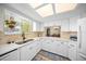 Well-lit kitchen featuring white cabinets, light countertops, and stainless steel appliances at 8461 Sw 109Th St, Ocala, FL 34481