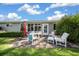 Inviting outdoor patio featuring stylish furniture, ideal for relaxation and entertainment at 8461 Sw 109Th St, Ocala, FL 34481