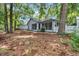 Backyard featuring screened-in lanai and mature trees at 8775 Sw 192 Ct, Dunnellon, FL 34432