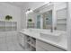 Bright bathroom with double vanity, sleek fixtures, and ample storage space at 8775 Sw 192 Ct, Dunnellon, FL 34432
