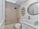 Bathroom with shower-tub combo, storage shelves, toilet, and vessel sink at 8775 Sw 192 Ct, Dunnellon, FL 34432