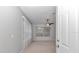 Bright bedroom with a ceiling fan and a large window offering plenty of natural light at 8775 Sw 192 Ct, Dunnellon, FL 34432