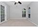 Bedroom with neutral carpet and a ceiling fan at 8775 Sw 192 Ct, Dunnellon, FL 34432
