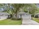 Beautiful single-story home featuring manicured lawns and landscaping at 8775 Sw 192 Ct, Dunnellon, FL 34432