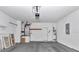 Spacious garage featuring ample storage and utility connections for convenience at 8775 Sw 192 Ct, Dunnellon, FL 34432