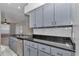 Modern kitchen with stainless steel appliances, granite countertops, and tile backsplash at 8775 Sw 192 Ct, Dunnellon, FL 34432