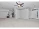 Spacious living room with plush carpeting, neutral paint, and an open floor plan at 8775 Sw 192 Ct, Dunnellon, FL 34432