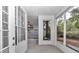 The screened porch offers great natural light and access to the outdoors at 8775 Sw 192 Ct, Dunnellon, FL 34432