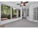 View of the screened porch with backyard access, natural light and neutral tones at 8775 Sw 192 Ct, Dunnellon, FL 34432