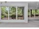View of the screened porch with abundant natural light and outdoor views at 8775 Sw 192 Ct, Dunnellon, FL 34432