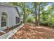 View of the side yard featuring green landscaping and a walkway at 8775 Sw 192 Ct, Dunnellon, FL 34432