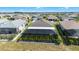 Expansive aerial view showcasing the home's screened-in pool and surrounding community at 8913 Sw 76Th Ln, Ocala, FL 34481
