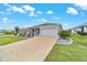 Charming single-story home featuring a well-manicured lawn and a two-car garage at 8913 Sw 76Th Ln, Ocala, FL 34481